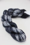 Close-up of Artyarns Silk Essence Lace silk yarn skein showing its soft, shiny silk fibers and delicate lace texture.