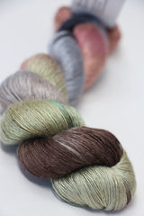 Soft silk yarn from Artyarns Silk Essence Lace collection, showcasing delicate, luxurious silk fibers in a neutral color.