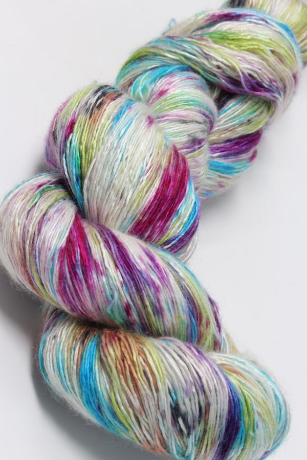 Colorful skein of Artyarns Ensemble Light yarn in Cosmic Colors, showcasing vibrant, soft-textured knitting yarn.