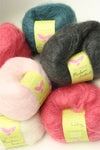Be Sweet medium brushed mohair yarn in natural fiber, showcasing soft, fluffy texture and light, airy appearance for knitting projects.