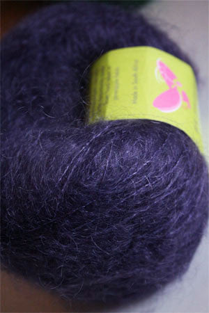 Be Sweet medium brushed mohair yarn in indigo color, showcasing soft, textured fibers ideal for knitting and crochet projects.
