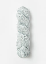 Blue Sky Fibers Suri Merino alpaca and merino yarn in soft blue, showcasing the smooth, fiber-rich texture of the yarn.