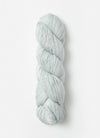 Blue Sky Fibers Suri Merino alpaca and merino yarn in soft blue, showcasing the smooth, fiber-rich texture of the yarn.