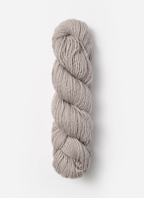 Blue Sky Fibers Suri Merino alpaca and merino yarn in soft blue, showing its smooth, luxurious fiber texture.