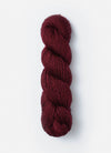 Blue Sky Fibers Suri Merino alpaca and merino yarn in soft blue color, showcasing the textured fiber close-up.