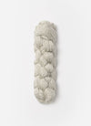 Blue Sky Fibers Metalico alpaca yarn in a soft blue shade, showcasing the textured, shiny fiber with a close-up view.