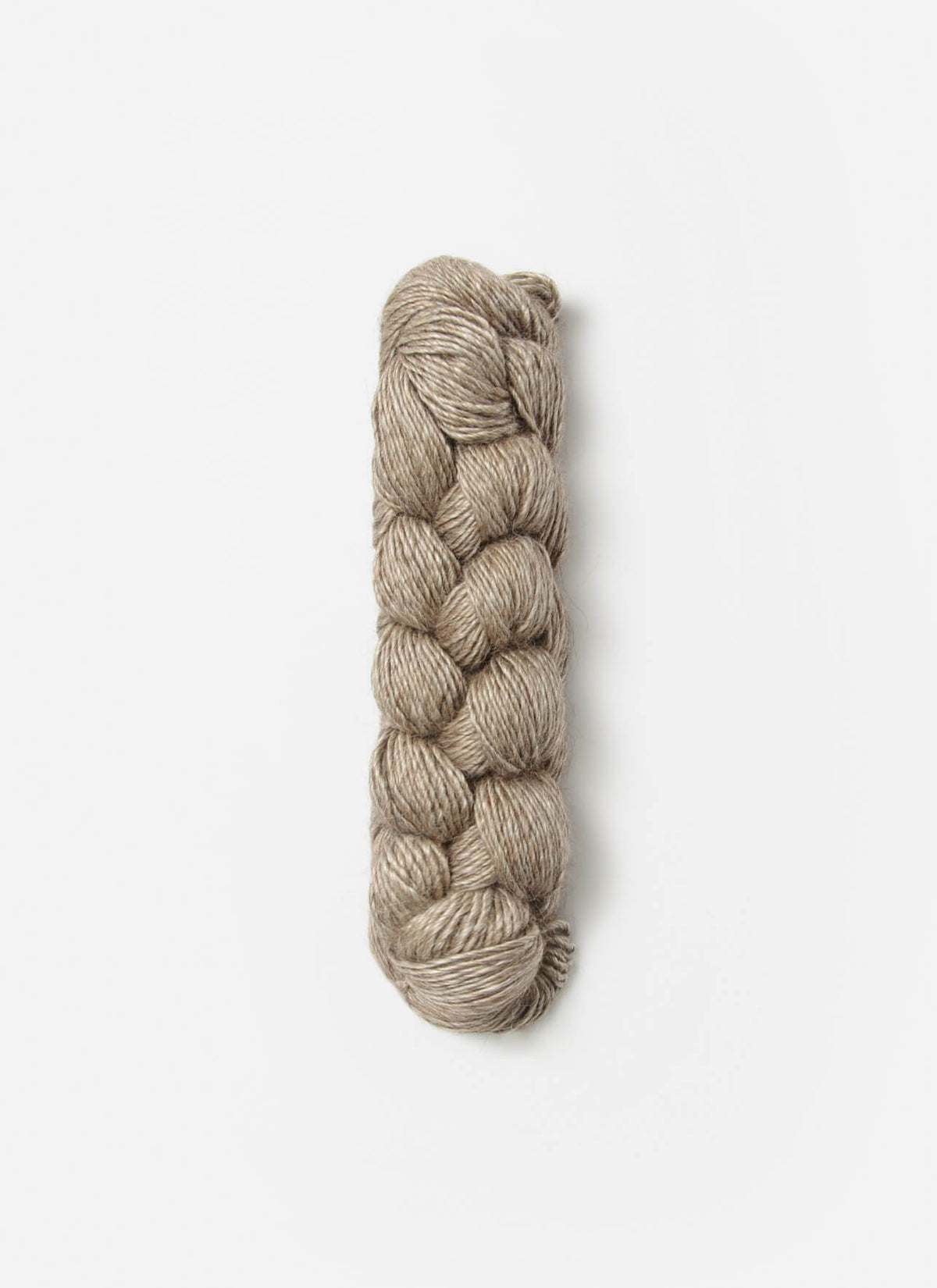 Blue Sky Fibers Metalico alpaca yarn in natural blue color, showcasing soft, shiny fiber with a smooth texture.