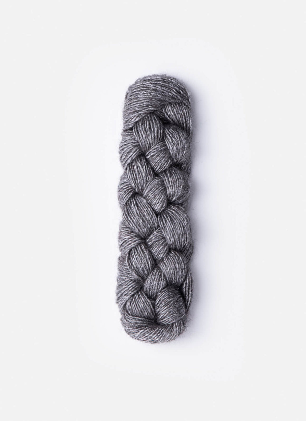 Blue Sky Fibers Metalico alpaca yarn in a soft blue color, showcasing the textured, shiny fiber suitable for knitting or crochet projects.