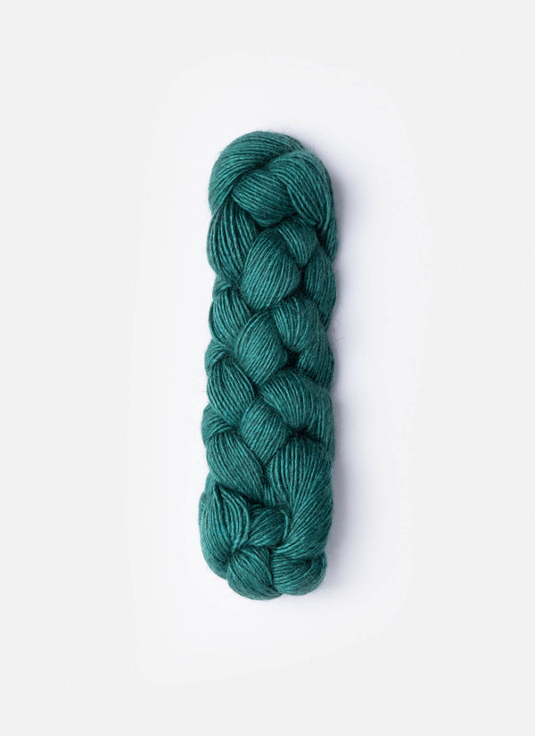 Blue Sky Fibers Metalico alpaca yarn in soft blue color, showcasing the textured, metallic-finished fiber bundle.