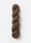 Blue Sky Fibers Baby Alpaca Sport Weight solid alpaca yarn in a soft blue color, showing the smooth, spun fiber texture.