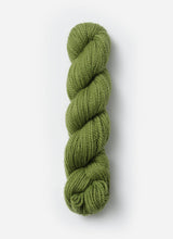 Blue Sky Fibers Baby Alpaca Sport Weight solid alpaca yarn in soft blue color, showing a close-up of the smooth, lightweight fiber.