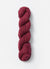 Blue Sky Fibers Baby Alpaca Sport Weight Melange alpaca yarn showcasing soft, multicolored skein in natural light.
