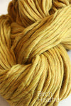 Cascade Yarns Magnum bulky yarn in Birch Heather color, showing a close-up of the soft, textured fiber.