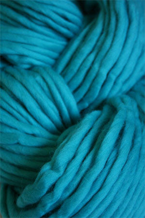 Bright blue Cascade Yarns Magnum bulky yarn ball with a soft, textured appearance on a white background.