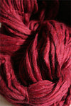 Close-up of Cascade Yarns Magnum bulky yarn in vibrant colors, showcasing its thick, soft texture perfect for cozy knitting projects.