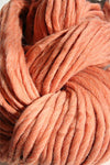 Cascade Yarns Magnum bulky yarn in vibrant multicolor, showcasing thick, soft wool fibers ideal for cozy knitting projects.