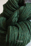 Close-up of Cascade Yarns Magnum bulky yarn in soft, variegated shades, showcasing its thick, cozy texture.