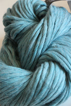 Cascade Yarns Magnum bulky yarn in summer sky heather color, showing soft, thick, and cozy fiber for knitting or crochet projects.