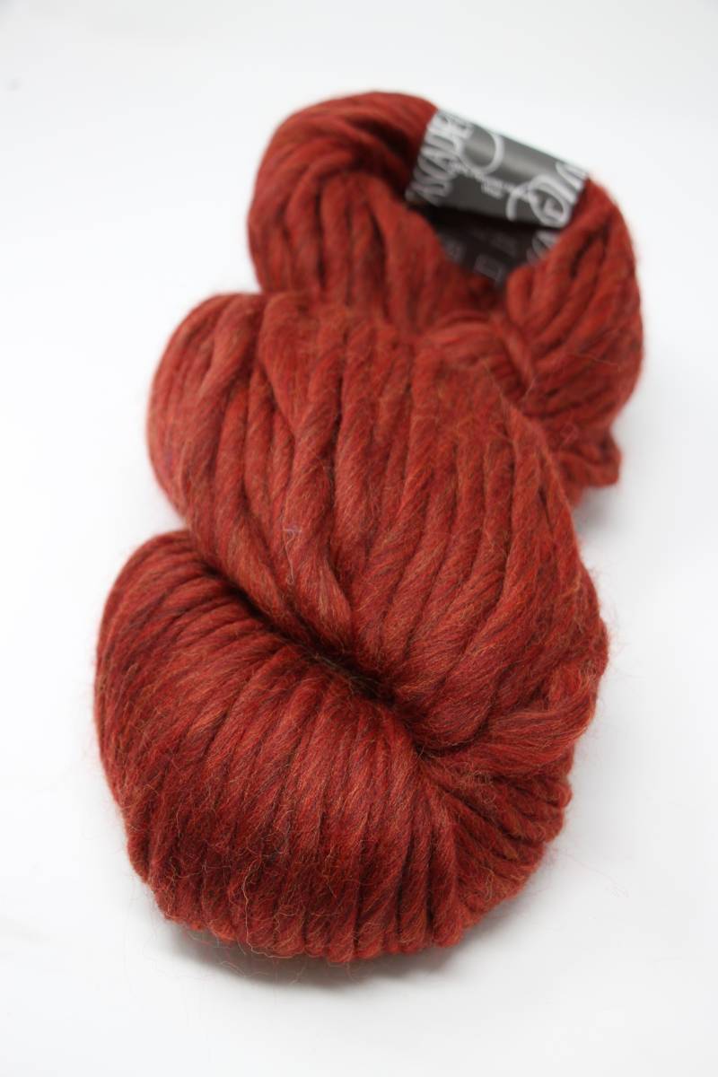 Cascade Yarns Magnum bulky yarn in Campfire Heather color, showcasing thick, soft, and textured yarn fibers.