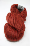 Cascade Yarns Magnum bulky yarn in Campfire Heather color, showcasing thick, soft, and textured yarn fibers.