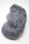 Cascade Yarns Magnum bulky yarn in Ebony Flurry color, showing thick, soft yarn skein for knitting and crochet projects.