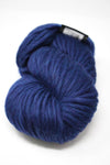 Cascade Yarns Magnum bulky yarn in Midnight Heather, showing thick, soft yarn with a blend of dark and light gray tones.