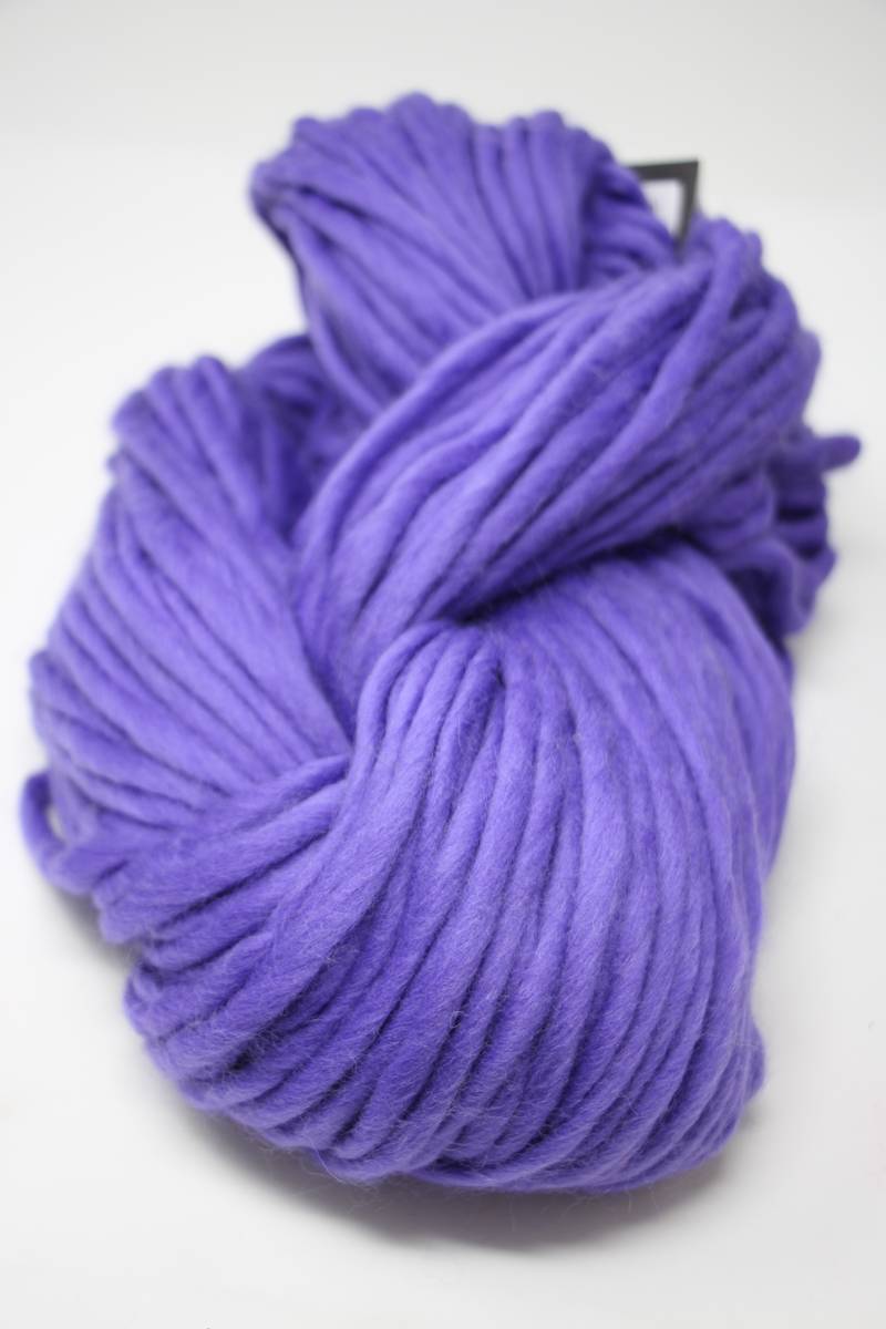 Cascade Yarns Magnum bulky yarn in vibrant ultraviolet color, showcasing thick, soft yarn ideal for cozy knitting projects.