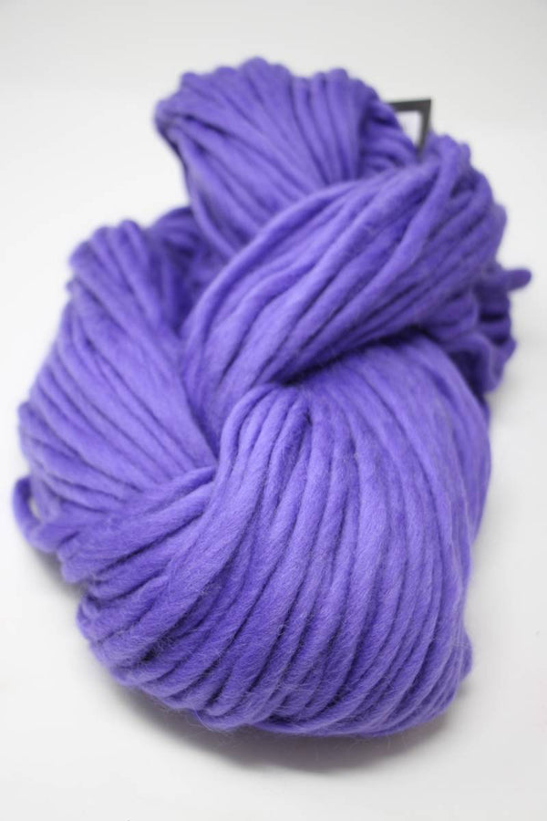 Cascade Yarns Magnum bulky yarn in vibrant ultraviolet color, showcasing thick, soft yarn ideal for cozy knitting projects.
