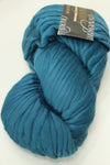 Close-up of Cascade Yarns Magnum bulky yarn in a neutral color, showcasing its thick, soft texture suitable for warm knitting projects.