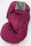 Close-up of Cascade Yarns Magnum bulky yarn in a neutral color, showcasing thick, soft wool for knitting or crocheting projects.