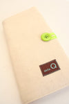 Della Q interchangeable needle case holding multiple sewing needles with a soft fabric exterior and secure closure.