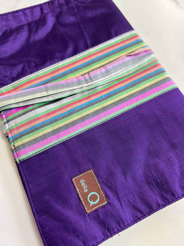 Della Q double point knitting needle case with purple stripe fabric, designed to hold and organize knitting needles.