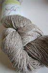 Jade Sapphire Sylph linen and cashmere yarn ball showcasing soft, luxurious blend in natural cream color.