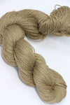 Golden-colored Jade Sapphire Sylph linen and cashmere yarn skein, soft and luxurious for knitting or crochet projects.