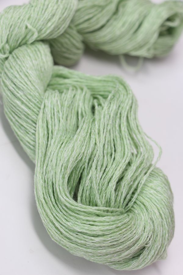 Close-up of Jade Sapphire Sylph linen and cashmere yarn skein showing soft, lightweight fibers in natural beige and cream tones.