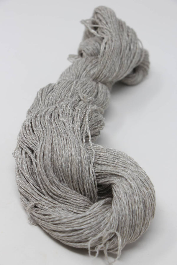 Jade Sapphire Sylph linen and cashmere yarn in rust color, showcasing soft, textured fibers for knitting or crochet projects.