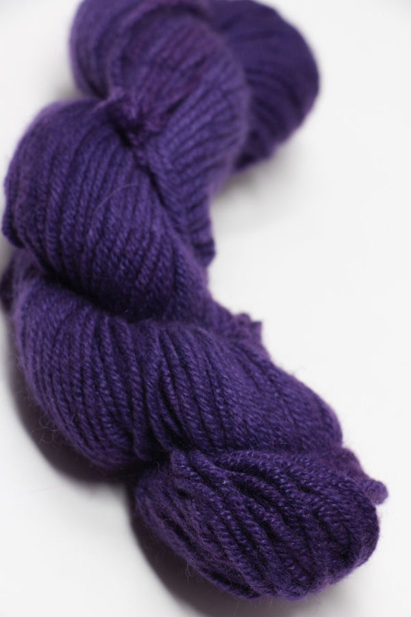 Jade Sapphire Zageo 6 Ply Cashmere yarn in rich purple color, showcasing soft, luxurious cashmere fibers.