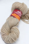 Jade Sapphire Zageo 6 Ply Cashmere yarn in driftwood color, showcasing soft, luxurious cashmere fibers coiled neatly in a ball.