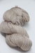 Madelinetosh Tosh DK yarn in Antique Lace color, showcasing soft, lightweight wool and silk blend for knitting or crochet projects.