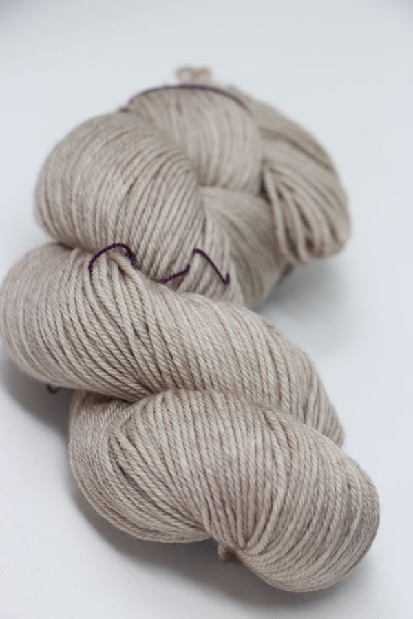 Madelinetosh Tosh DK yarn in Antique Lace color, showcasing soft, lightweight wool and silk blend for knitting or crochet projects.