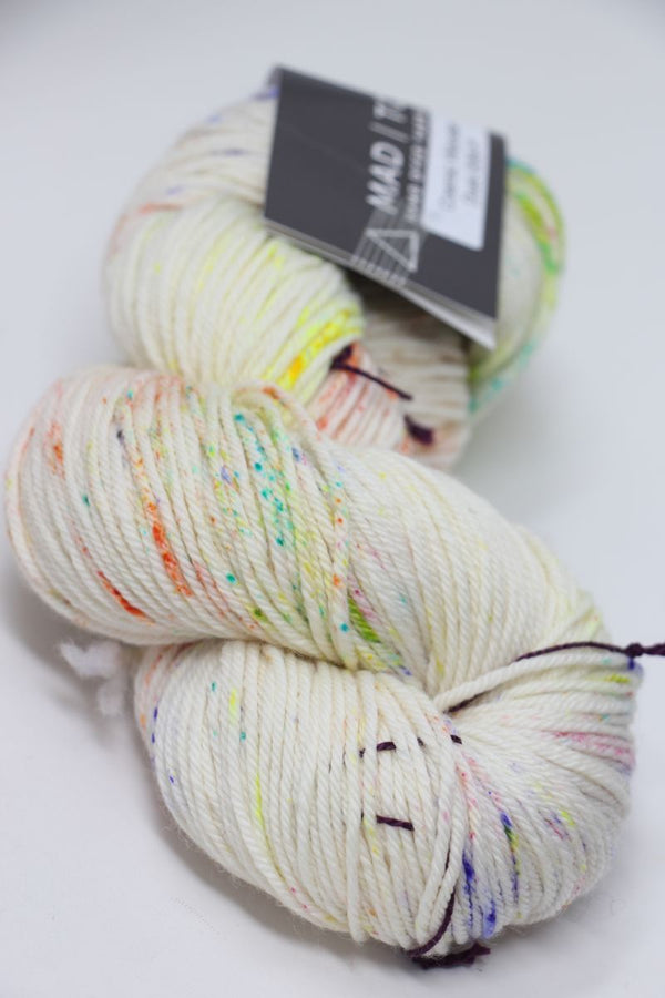 Madelinetosh Tosh DK yarn in Cosmic Wonder Dust, soft and variegated wool fiber for knitting and crocheting projects.