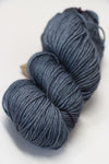 Madelinetosh Tosh DK yarn in a deep rust color, soft and thick-dyed wool for knitting and crochet projects.