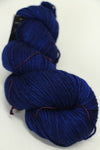 Madelinetosh Tosh DK yarn in Fathom colorway, soft and versatile wool blend, shown in a close-up view of the skein.