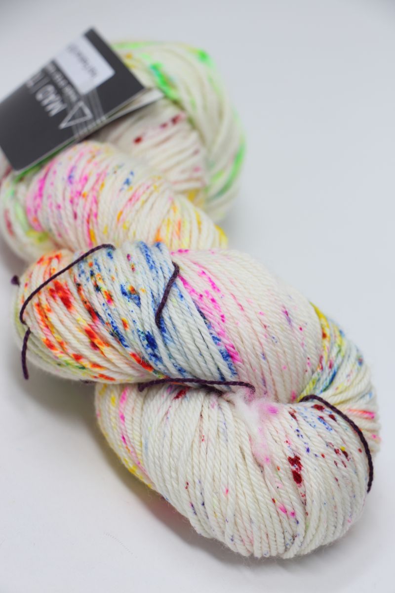 Madelinetosh Tosh DK yarn in Holi Festival colorway, soft wool blend with vibrant multicolor dye, ideal for knitting and crochet projects.