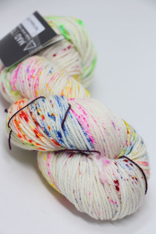 Madelinetosh Tosh DK yarn in Holi Festival colorway, soft wool blend with vibrant multicolor dye, ideal for knitting and crochet projects.