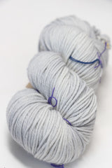 Madelinetosh Tosh DK yarn in Silver Fox color, showing a close-up of soft, hand-dyed wool yarn with subtle gray tones.
