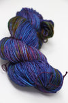 Madelinetosh Tosh DK yarn in Spectrum colorway, showing vibrant multicolored skein of soft, lightweight wool yarn for knitting or crochet.