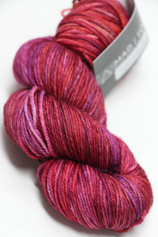 Madelinetosh Tosh DK yarn in Cactus Flower color, soft and vibrant wool yarn skein for knitting or crochet projects.