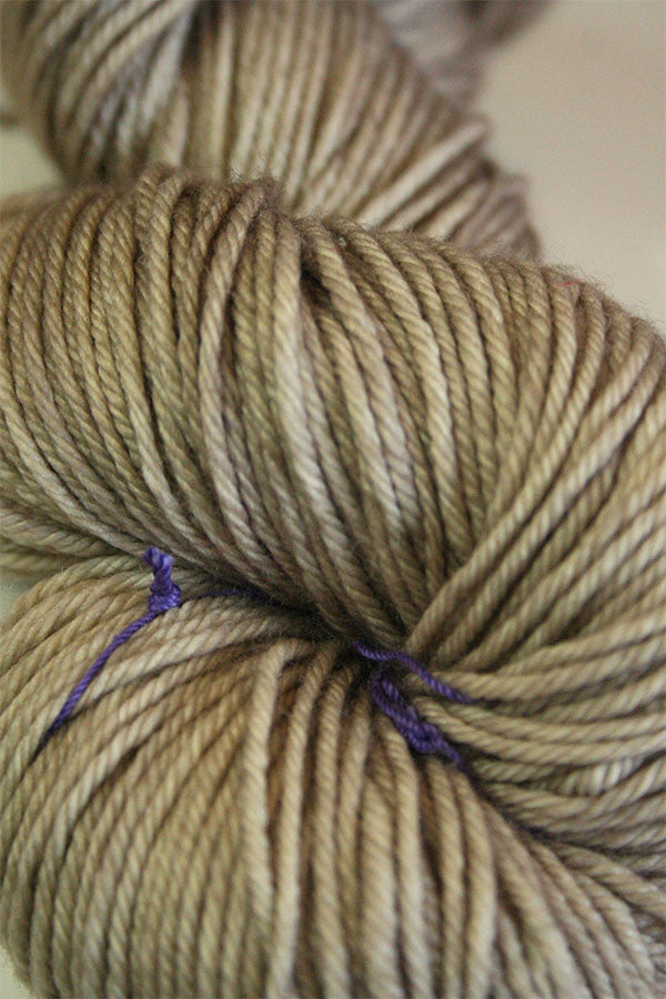 Madelinetosh Tosh DK yarn in Antique Lace color, showing soft, chunky wool fibers with subtle color variations.
