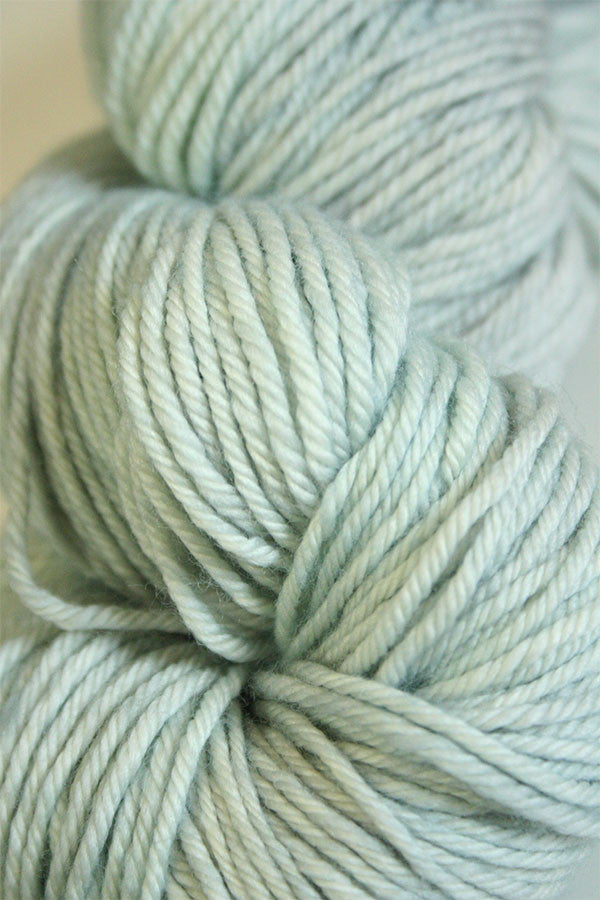 Madelinetosh Tosh DK yarn in Moonglow color, soft and vibrant wool for knitting or crochet projects.